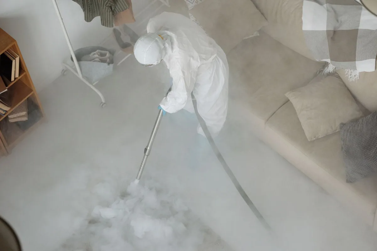 Biohazard cleanup technician in protective equipment, Signal Mountain, TN